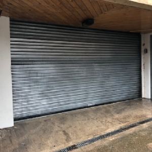 View Graffiti removed from shop shutters