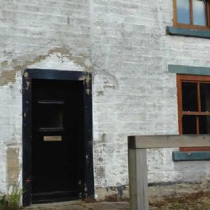 View Stone house before blast cleaning