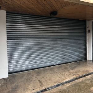 View Graffiti removed from shop shutters